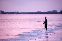 Lone Fisherman at Sunset