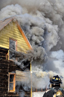 Firefighter and Smoking House